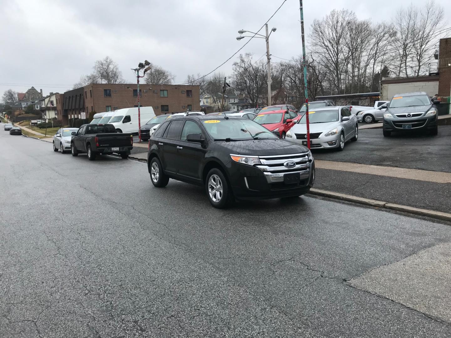 2011 Black /Cream Ford Edge SEL (2FMDK3JCXBB) with an 3.5 V6 engine, Automatic transmission, located at 577 Chester Pike, Prospect Park, PA, 19076, (610) 237-1015, 39.886154, -75.302338 - Photo#1